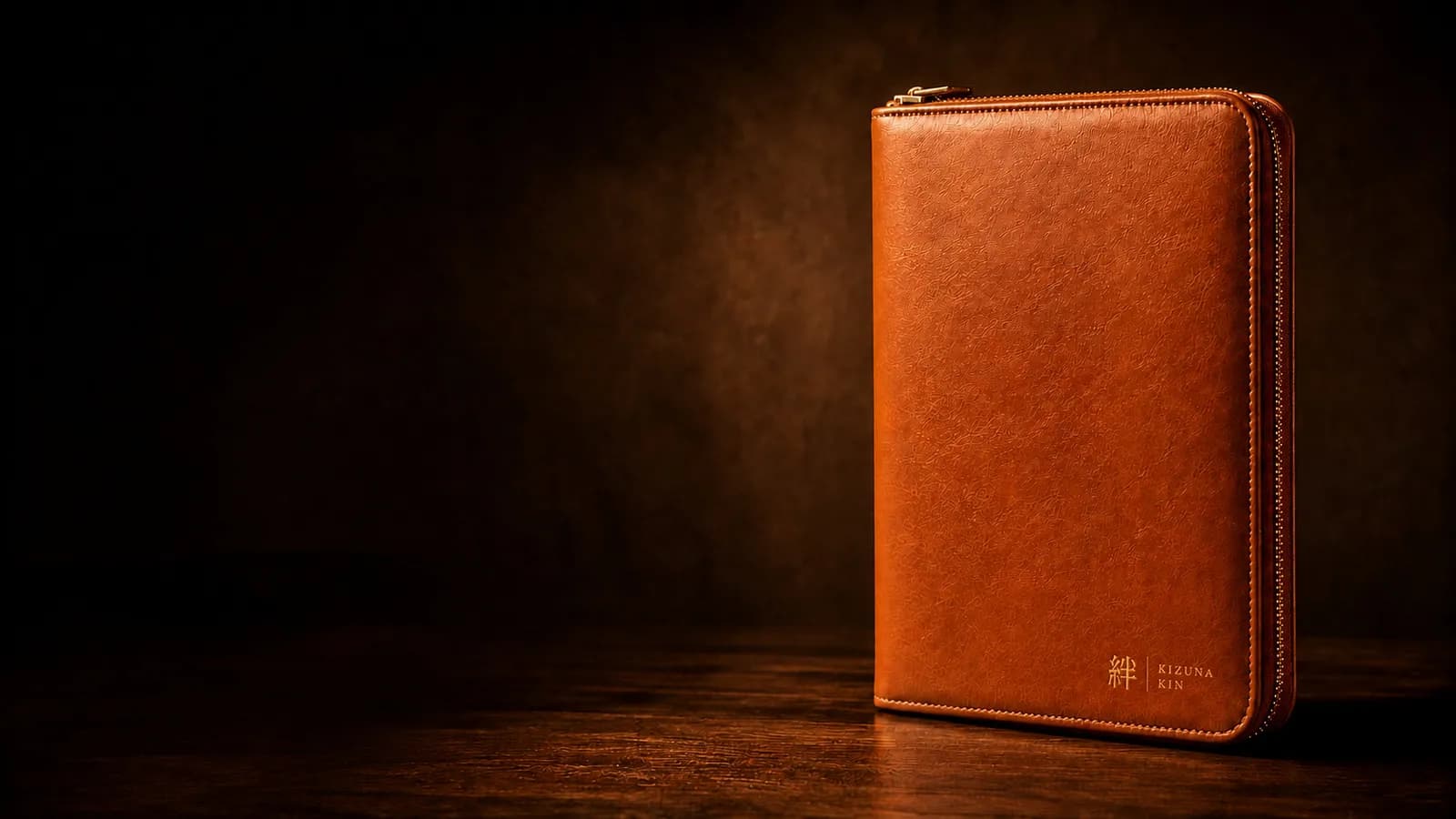 Kizuna Kin binder with a gold 絆 mark on a dark background