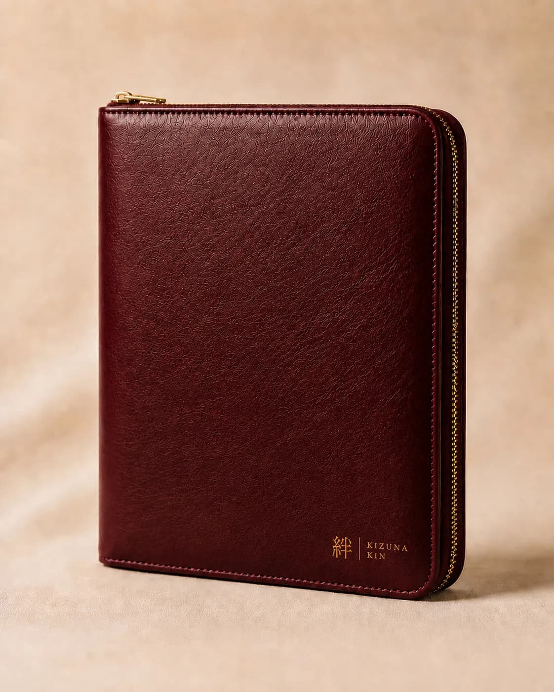 Oxblood Kizuna Kin binder with a gold 絆 corner mark